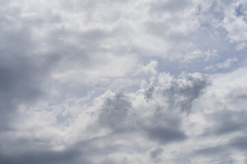 Obraz premium Soft white and gray clouds across blue sky forming natural cloudy background for graphic design projects