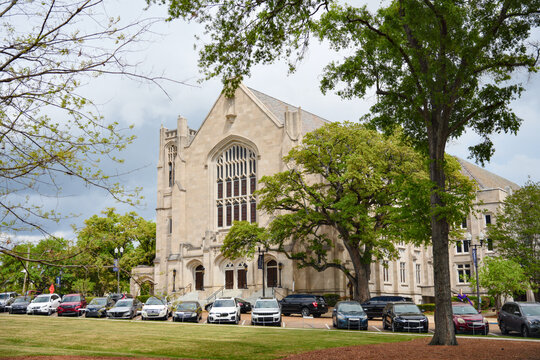 Gothic Stone Church Building with Parked Cars and Trees Jackson MS