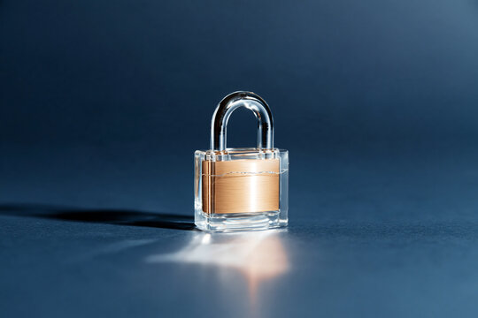 Transparent Glass Padlock on Blue Surface Against Clear Sky as Security Concept