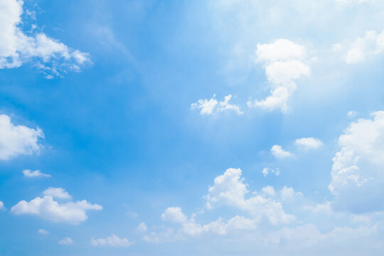 Blue sky with some clouds. View over the clouds light background. 