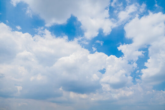 Blue sky with some clouds. View over the clouds light background. 