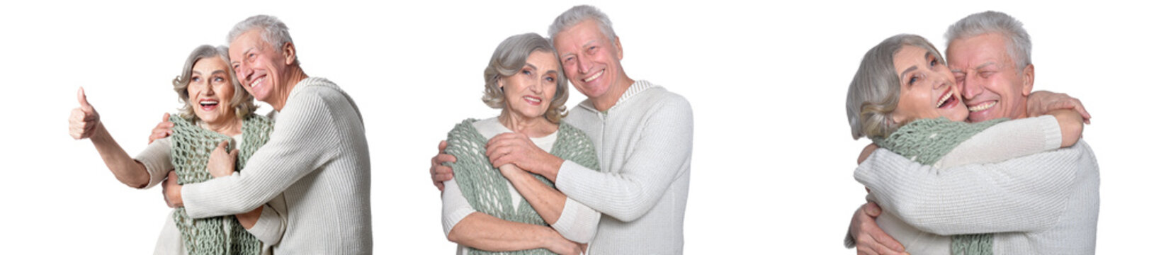 Happy senior couple hugging and smiling on white background