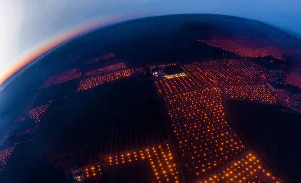 FRANCE, GIRONDE 33 POMEROL, AERIAL VIEW, CANDLES BURNING IN THE VINEYARD DURING A FROST PERIOD WITH TEMPERATURES BELOW ZERO APRIL 7, 2021