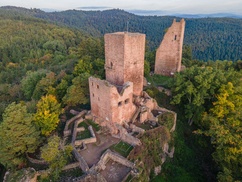 FRANCE. ALSACE. HAUT-RHIN 68 AERIAL VIEW OF EGUISHEIM. AUTUMN COLOURS AT THE THREE CASTLES, MEDIEVAL RUINS FROM THE 10TH?12TH CENTURIES PERCHED ON THE SCHLOSSBERG 591 M