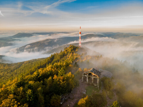 FRANCE. ALSACE. BAS-RHIN 67 GRANDFONTAINE. AT THE SUMMIT OF THE DONON, THE TEMPLE STANDS OUT AGAINST THE AUTUMN MIST, CASTING A MYSTICAL SILHOUETTE IN THE HEART OF THE VOSGES MOUNTAINS.