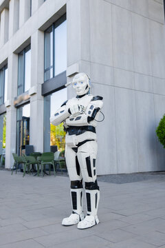 Full length white android standing with arms crossed