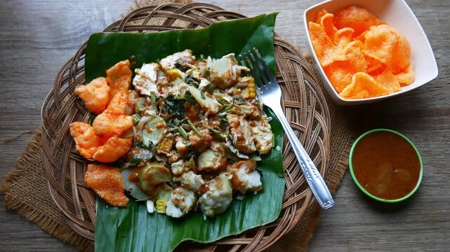 Top view Gado - gado Indonesian traditional food with peanut sauce and crackers