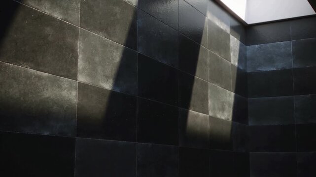 Drifting ribbon arching across dark tile well, square skylight beam moving and lifting dust