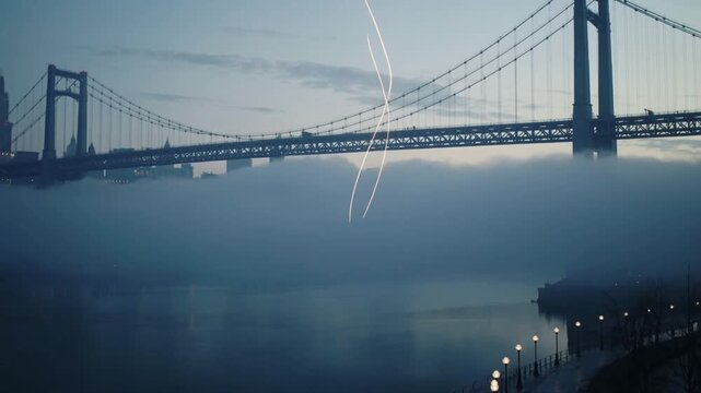 Appearing golden light ribbon spiraling up riverside-dusk, weaving steps rail lamp-posts fog bridge