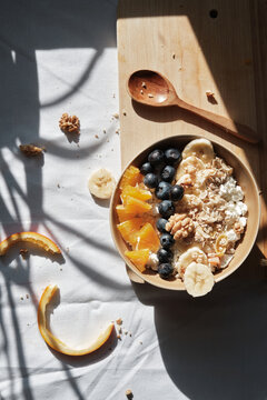 Oatmeal cereal, fruit, and berries for healthy breakfast