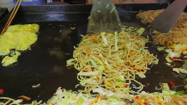 Chow Mein or Lo Mein are stir-fried wheat noodles tossed with vegetables in Lijiang old town ,Yunnan, China.