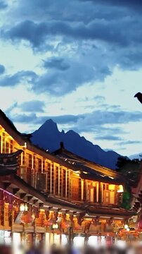 Golden Week Crowd in Lijiang Old Town with Jade Dragon Snow Mountain, Yunnan, China.