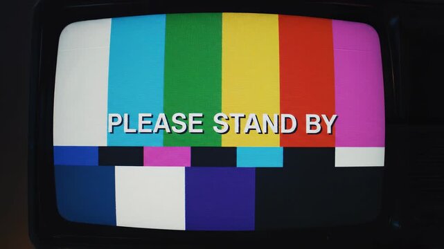 Retro television test pattern with static transitioning across six screens during broadcast interruption