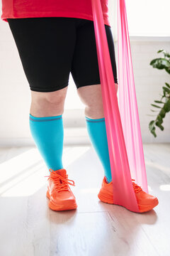 Exercising with resistance band at home training