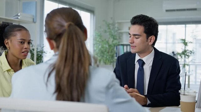 business people meeting and discussion in the office while working on a company project.Business teamwork and team doing corporate research in discussion together with technology in workplace