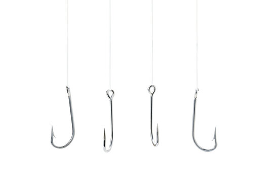Four Metallic Fishing Hooks Hanging from Vertical Lines