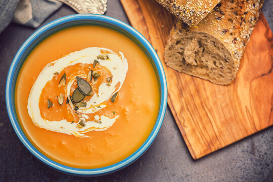 Fresh hot homemade pumpkin soup with cream