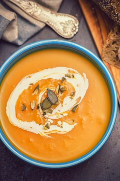 Fresh hot homemade pumpkin soup with cream
