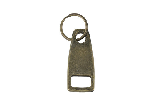 Old weathered brass metal keychain with a bottle opener feature, isolated against a clean white background