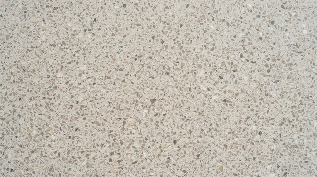 Close-up texture of light beige speckled granite countertop surface.