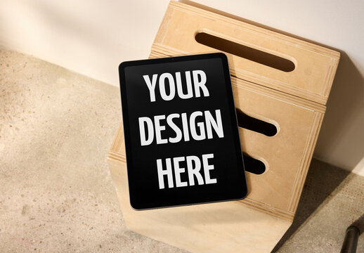 Mockup Of Customizable Tablet Screen On Wooden Crate