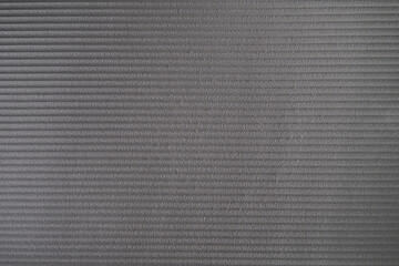 grey foam insulation texture, porous structure detail of a foam yoga mat