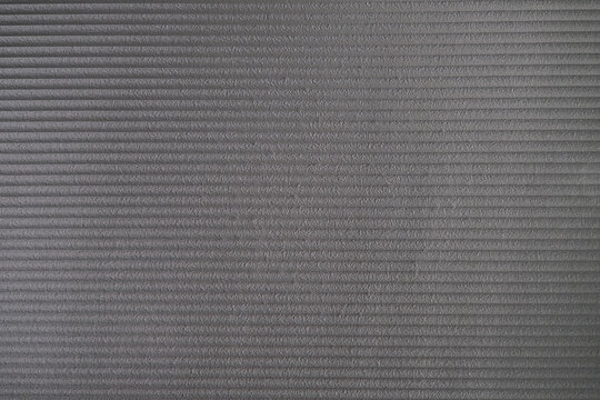 grey foam insulation texture, porous structure detail of a foam yoga mat