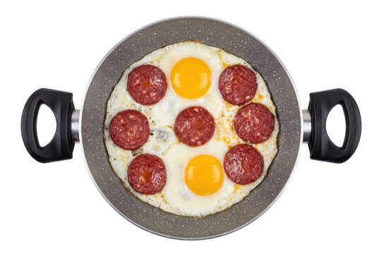 Fried Eggs with Salami Slices in a Granite Frying Pan Overhead View