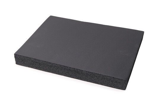 gray yoga mat with foam texture, porous structure detail isolated on white