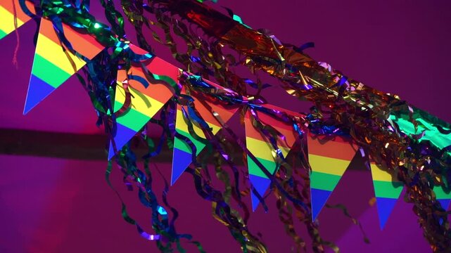 Colorful pride flags and shiny tinsel decorations for a LGBT celebration