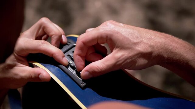 Musician adjusts the onboard equalizer sliders and volume knob on an acoustic guitar. Tactile control over sound frequencies offers creative value for music production tutorials.