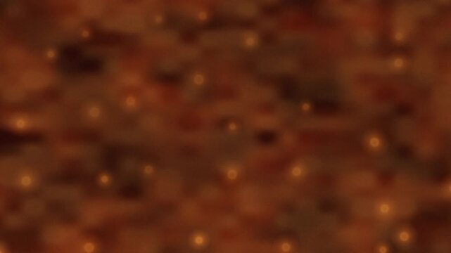Orange bokeh lights on dark background. 2d animation
