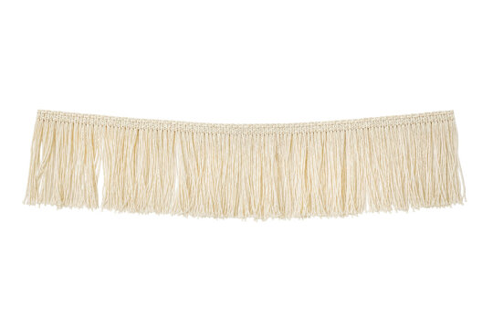 Long, light beige fringe trim with a woven top edge, featuring many hanging threads, isolated on a clean white background