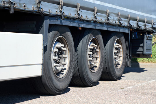Berlin, Germany - August, 13 2026: Truck trailer wheels close up showing Bridgestone Duravis R-Trailer tires three side axle rubber wheels heavy cargo logistics road transport vehicle equipment detail