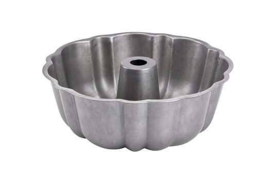 Single empty silver aluminum bundt cake pan with a fluted design is presented on a clean white background