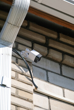 CCTV surveillance security camera video equipment on house wall outdoor