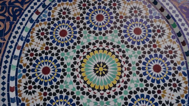 Colorful Moroccan mosaic tile pattern. This intricate design features vibrant colors and geometric shapes, creating a visually captivating display. interior design.
