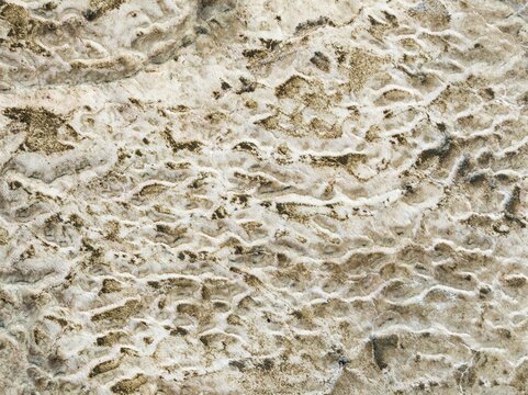 Abstract patterns of saline deposits at the salt works of Walvis Bay. Aerial view. Drone shot. Namibia