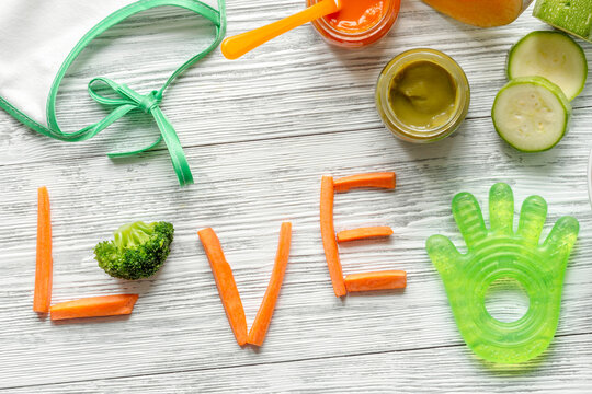 baby vegetable puree on wooden background top view
