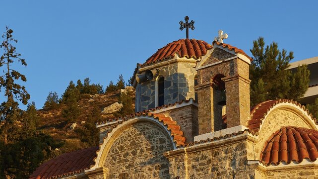 Church with red roof tiles and crosses in the middle of a mountain landscape, mountain villages Aperi and Volada, morning light, Karpathos, Dodecanese, Greek Islands, Greece