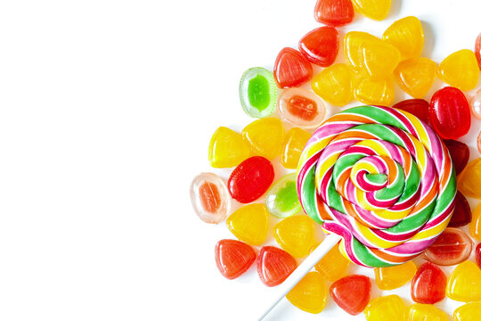 sweets and sugar candies on white background top view
