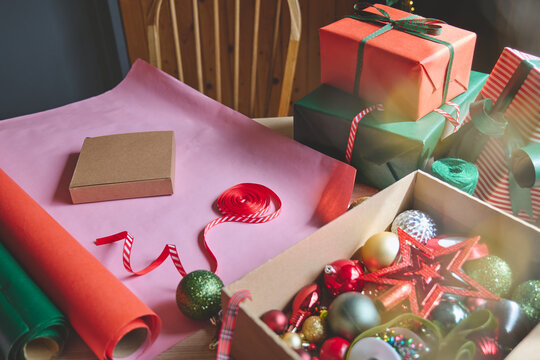Wrapping Christmas gifts at home.
Preparing presents for loved ones reflects holiday shopping, seasonal celebrations, gift giving and the joy of Christmas traditions.