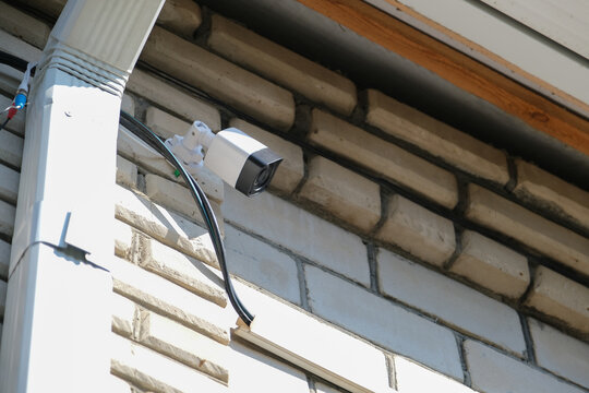 urveillance security camera video equipment on house wall outdoor
