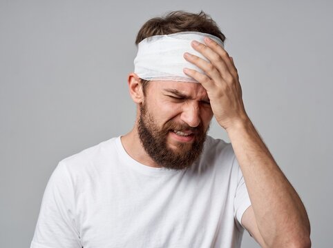 Young Man Head Suffering from Severe Concussion Headache and Pain