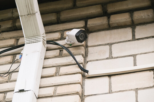 surveillance security camera video equipment on house wall outdoor