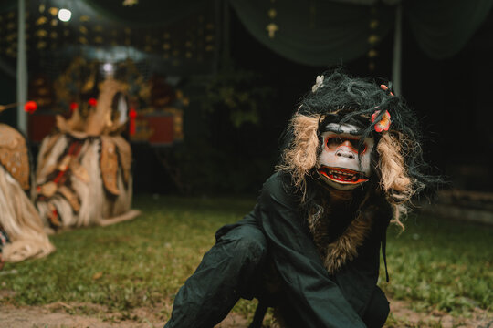 Monkey and Barong Balinese mask dance traditional culture on Indonesia at night