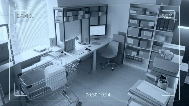 CCTV high angle footage showing empty shipping office with parcels on shelves and desk. Perfect for e-commerce security, supply chain logistics, and retail store management commercials