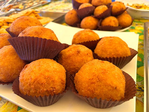 Ballar&ograve; Market. Sicilian arancini. Street food in Italy.