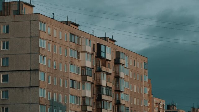 Soviet-Era Panel Apartment Block Under Moody Overcast Sky