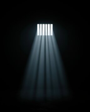 Bright light beams streaming through dark prison cell window bars creating a moody atmosphere. Symbolic representation of imprisonment or hope.